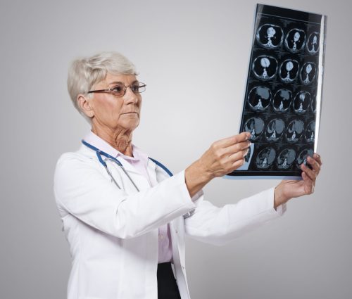 Focus senior woman analyzing test result